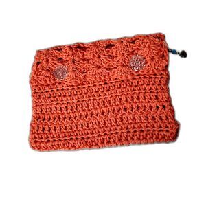 Hand Crocheted Clutch Purse with a Peace Tag attached at the upper right corner